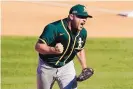  ?? MARCIO JOSE SANCHEZ/ASSOCIATED PRESS ?? Oakland reliever Liam Hendriks reacts after striking out Houston’s Josh Reddick to snuff out an Astros uprising in the eighth inning Wednesday.