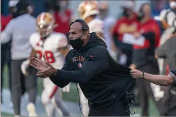  ?? STEPHEN BRASHEAR — THE ASSOCIATED PRESS, FILE ?? San Francisco 49ers defensive coordinato­r Robert Saleh cheers on his team from the sideline during the first half against the Seahawks on Nov. 1 in Seattle.