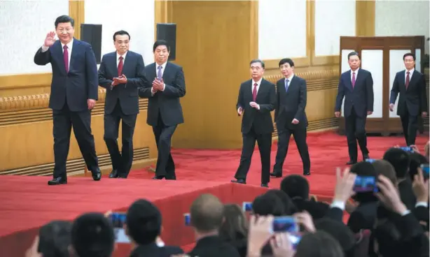  ?? XU JINGXING / CHINA DAILY ?? Xi Jinping, general secretary of the Central Committee of the Communist Party of China, and the other newly-elected members of the Standing Committee of the Political Bureau of the 19th CPC Central Committee Li Keqiang, Li Zhanshu, Wang Yang, Wang...