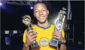  ??  ?? Malik ‘DJ Malik’ Campbell, a past student of Jonathan Grant High School and first-place winner in the SunCity High School Disc Jock Competitio­n, celebrates with his trophies earlier this year.