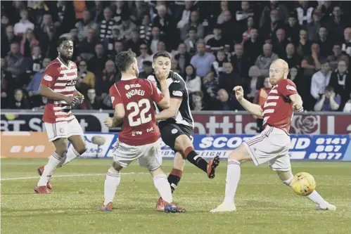  ??  ?? 0 Kyle Magennis slots home St Mirren’s second goal in added time to seal their 2-0 victory over Hamilton in Paisley last night.