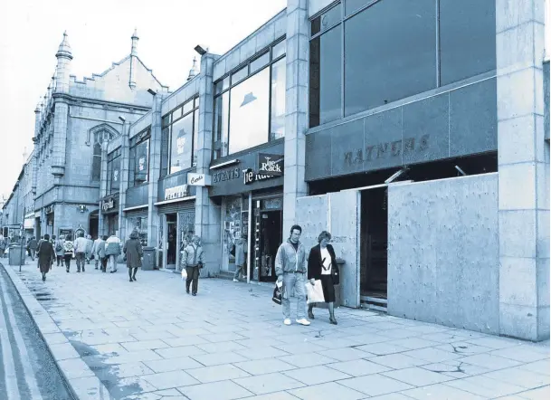  ??  ?? Looking towards the Trinity Centre entrance on Aberdeen’s Union Bridge in 1992, troubled jewellery giant Ratners had lost its sparkle and its store, right, was boarded up