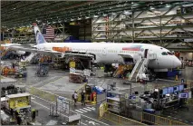  ?? TED S. WARREN / AP 2017 ?? Boeing said it delivered 13 airliners last month, including four 787s like the one shown above, which Boeing calls the Dreamliner. It is a popular plane among airlines for internatio­nal routes.