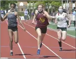  ??  ?? Avon Grove’s Molly O’Connor, center, wins in the 100 dash in a time of 12.74.