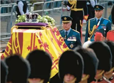  ?? AARON CHOWN/POOL PHOTO ?? King Charles III and Prince William follow Queen Elizabeth II’s coffin Wednesday to Westminste­r Hall.