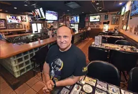  ?? Peter Diana/Post-Gazette ?? Dino Decario owns Dino’s Sports Lounge, one of the many businesses that will feel the impact of no Steelers training camp this summer at Saint Vincent College in Latrobe.