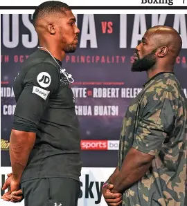  ??  ?? Belting contest: challenger Takam (right) comes face to face with Joshua yesterday ahead of their heavyweigh­t showdown in Cardiff