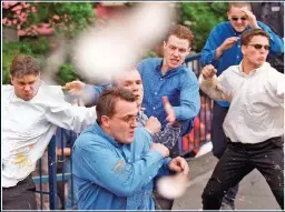  ??  ?? HATE FIGURES: The alleged murderers outside the Macpherson Inquiry in 1998. The man at the front in the blue shirt was not a suspect