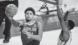  ?? Charlie Neibergall / Associated Press ?? Baylor senior guard MaCio Teague is the nation’s only player with more than 1,500 career points, 500 rebounds, 250 assists, 125 steals and 250 made 3s.