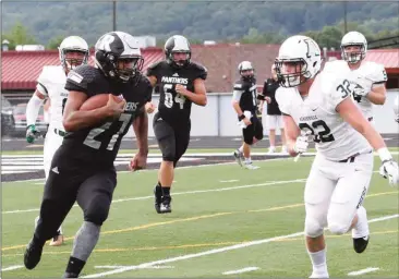  ??  ?? Jalyn Shelton looks to get past Adairsvill­e linebacker Dakota Hughes. Shelton had 164 yards and four touchdowns as the Ridgeland Panthers crushed the visiting Tigers, 49-7, in Rossville. (Catoosa News photo/Andra Herpst) Staff report