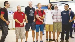  ?? REUTERS ?? British cave divers (from left) Rick Stanton, Chris Jewell, Connor Roe, Josh Bratchley, Jim Warny, Mike Clayton and Gary Mitchell return to London yesterday, after helping in the rescue of the 12 boys and their coach in Thailand.