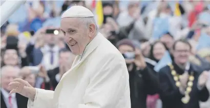  ?? Picture: AFP ?? MEETING THE FAITHFUL. Pope Francis greets the crowd upon his arrival at Knock Shrine in County Mayo yesterday, the second day of his visit to Ireland to attend the 2018 World Meeting of Families.