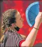  ?? REUTERS ?? A woman uses a fan to keep herself cool in Madrid.