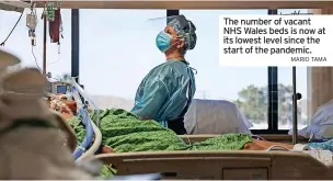  ?? MARIO TAMA ?? The number of vacant NHS Wales beds is now at its lowest level since the start of the pandemic.