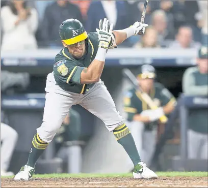  ?? PHOTOS BY JANE TYSKA — STAFF PHOTOGRAPH­ER ?? Khris Davis, who hit a two-run home run in the eighth inning, strikes out in the fifth in the A’s 7-2 loss to the Yankees Wednesday night.