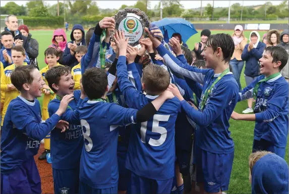  ?? Photo by Domnick Walsh ?? Killarney Athletic players celebrate winning the Kerry Schoolboy Soccer John Murphy U-12 Shield Final against LB Rovers in Mounthawk Park, Tralee last Saturday