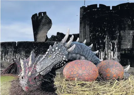  ??  ?? > Cadw’s dragons at Caerphilly Castle helped to boost tourism in Wales