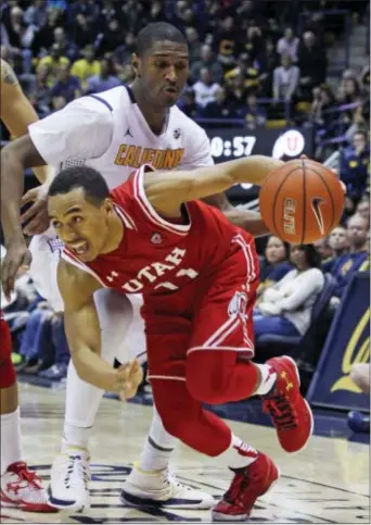  ?? GEORGE NIKITIN — THE ASSOCIATED PRESS ?? Utah’s Brandon Taylor, front, drives for the basket in front of California’s Jordan Mathews during the second half Sunday in Berkeley.