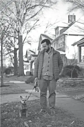  ?? JOSHUA A. BICKEL/COLUMBUS DISPATCH ?? Richard Duarte stops Thursday along Kelso Road in Columbus. Duarte, who lives in the Short North, has been looking to buy a house in this Clintonvil­le neighborho­od, but the market is highly competitiv­e for buyers, and he was outbid recently on a house on this street.