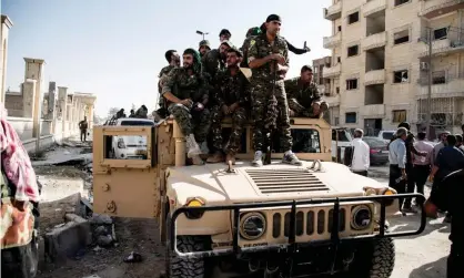  ??  ?? Fighters in the Syrian democratic forces inside Raqqa on 21 October. Kurdish-led forces declared victory in Isis’s Syrian ‘capital’ on Friday. Photograph: BaderKhan Ahmad / Barcroft Images