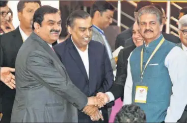  ?? PTI FILE ?? (From left to right) Industrial­ists Gautam Adani, Mukesh Ambani and Anand Mahindra at the UP Investors Summit 2018 at Indira Gandhi Pratishtha­n in Lucknow last week.