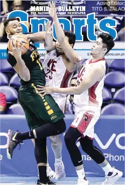  ??  ?? Far Eastern’s Prince Orizu, left, hangs on to the ball as he fends off University of the East’s Alvin Pasaol and Wilson Bartolome, right, during their UAAP Season 80 game yesterday at the Smart Araneta Coliseum. FEU won 90-83. (Rio Leonelle Deluvio)