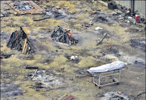  ?? AP ?? Funeral pyres of those who died of Covid-19 at a ground converted into a crematoriu­m in New Delhi.