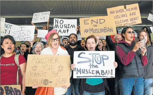  ?? Picture: REUTERS ?? OUTRAGE: Demonstrat­ors shout slogans during anti-Donald Trump immigratio­n ban protests outside Terminal 4 at San Francisco Internatio­nal Airport in San Francisco, California,