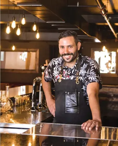  ??  ?? Ulises Sanchez is the bar manager at 21 Fir Whiskey Bar and Kitchen in Uptown Waterloo.