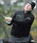  ?? Eric Risberg The Associated Press ?? Phil Mickelson follows through on a drive from the 11th tee at Spyglass Hill Golf Course in the second round of the AT&amp;T Pebble Beach Pro-am on Friday.