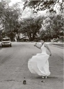  ?? Chris LeBlanc / Contributo­r ?? Pam LeBlanc put on her wedding dress for the first time in 21 years and began twirling in the middle of her street in Austin.