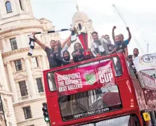  ?? ?? Slough Scorpionz celebrated last year's win with an open top bus ride through central London.