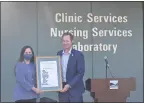  ?? JUSTIN COUCHOT — ENTERPRISE-RECORD ?? Monica Soderstrom, left, was presented the California Legislatur­e Woman of the Year Award by Assemblyma­n James Gallagher on Tuesday at the Butte County Public Health Office in Chico.