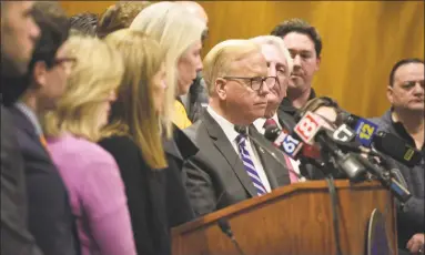  ?? H John Voorhees III / Hearst Connecticu­t Media ?? Danbury Mayor Mark Boughton, center, joined Gov. Ned Lamont and state and local officials, at a news conference at Danbury City Hall in March.