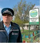  ?? PIERS FULLER/ STUFF ?? Right: Wairarapa area commander Inspector Scott Miller outside South End School.