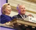  ?? ASSOCIATED PRESS FILE PHOTO ?? Then-Secretary of State Hillary Rodham Clinton rings the New York Stock Exchange opening bell, accompanie­d by then-NYSE CEO Duncan L. Niederauer, in New York on Sept. 21, 2009.