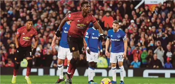  ?? REUTERS PIC ?? Manchester United’s Paul Pogba has a penalty saved before scoring the rebound against Everton at Old Trafford on Sunday.