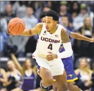  ?? Stephen Dunn / Associated Press ?? UConn and Jalen Adams will renew their rivalry with Syracuse on Thursday night at Madison Square Garden.