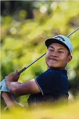  ?? — AFP ?? Determined: Lin Yuxin teeing off at the first hole of the Clearwater Bay Open at the Clearwater Bay Golf Club in Hong Kong.