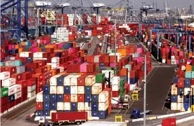  ?? Photograph: Mario Tama/Getty Images ?? Shipping containers are stacked at the Port of Los Angeles in San Pedro, California.