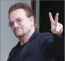  ??  ?? In this July 24, 2017, file photo, U2 singer Bono makes a peace sign as he arrives for a meeting at the Elysee Palace, in Paris, France. AP PHOTO/MICHEL EULER