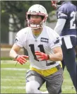  ?? Steven Senne / Associated Press ?? Patriots wide receiver Julian Edelman waits for the ball during a minicamp practice Thursday in Foxborough, Mass.