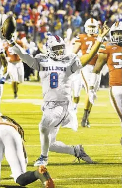  ?? AP ?? Louisiana Tech’s J’Mar Smith scores a touchdown against Miami in the Independen­ce Bowl on Thursday night.