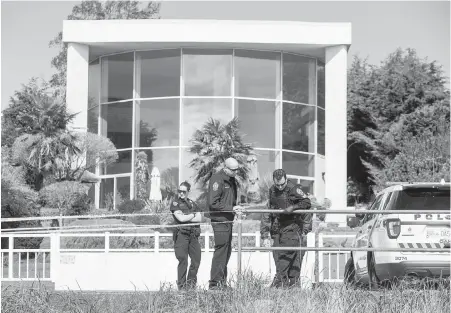  ??  ?? Police search the grounds near an Esplanade house where a man broke in and attacked a woman.