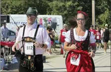  ??  ?? Folks take part in a charity race at a previous Cleveland Oktoberfes­t.