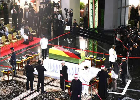  ?? — Bernama photo ?? Taib’s casket is seen as he lies in state at the atrium of the DUN Complex.