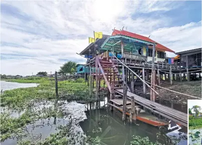  ??  ?? ● Rang Chorakhae Canal, which connects with Noi River near Ban Phaen was given its name because it used to be teeming with crocodiles (chorakae in Thai). These days, the large reptiles are no longer there although monitor lizards are still a common sight.
The family of Daorueng and her husband Reangchai Rerkbubpha (both seen in one of the photos) is one of five living on this canal that has been running a homestay service for visitors for almost two decades. For 600 baht per person, the two provide a package that includes a night stay, home-cooked meals made with native plants collected from the canal and on the waterside, a boat trip, fishing and a variety of other activities designed to encourage visitors to enjoy and absorb the rural lifestyle and folk