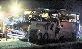  ?? KTHV via Associated Press ?? A charter bus ferrying migrant workers from Michigan to Laredo ran off Interstate 40 and hit an overpass Friday in Little Rock, Ark. A heavy storm recently had passed through the area, but it’s unknown if weather played a role.