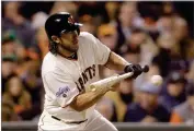  ?? ASSOCAITED PRESS ?? In this Wednesday, April 22, 2015 file photo, San Francisco Giants’ Madison Bumgarner bunts on a pitch from the Dodgers’ Clayton Kershaw.