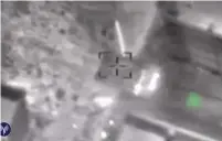  ?? (IDF) ?? AN IDF MISSILE hits enemy tanks in Syria yesterday in this image taken from a video.